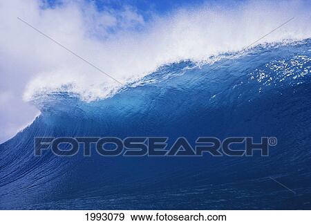 Stock Photo - Blue Wave Curling Over Forming Barrel With White Waters.. Fotosearch