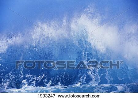 Blue Waves Crashing On The Shore With Blue Sky Background View Large Photo Image Stock Photo - Blue Waves Crashing On The Shore With Blue Sky Background. Fotosearch
