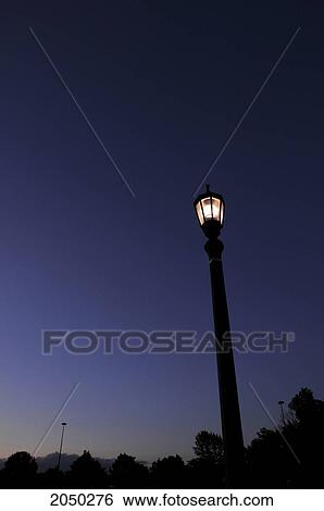 Boardwalk Lamp Against A Clear Blue Sky At Sunset, Toronto, Ontario View Large Photo Image Stock Photograph - Boardwalk Lamp Against A Clear Blue Sky At Sunset, Toronto, Ontario. Fotosearch