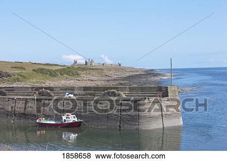 Stock Photo - Boat Along Wharf. Fotosearch