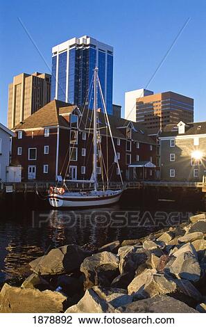 Stock Image - Boat And Waterfront Buildings. Fotosearch