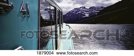 Picture - Boat Cruising On Lake Minnewanka. Fotosearch