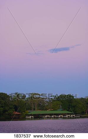 Stock Photo - Boat Dock On Tropical Rainforest River; Costa Rica. Fotosearch