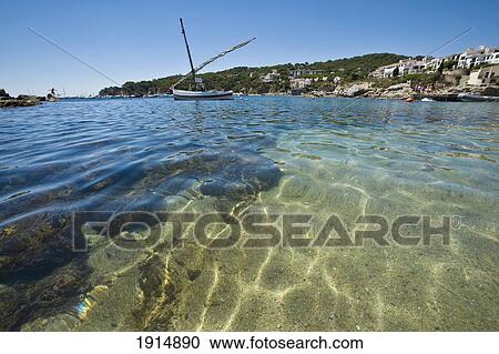 Stock Image - Boat In Calella Fishing Village. Fotosearch