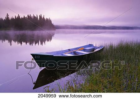 Stock Photo - Boat In Mist At Dawn, Rimouski Lake, Rimouski Wildlife Reserve, Bas-Saint-Laurent Region, Quebec. Fotosearch