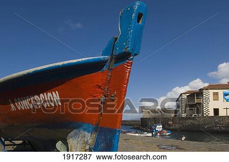 Stock Photo - Boat In Puerto Pesquero Fishing Harbour. Fotosearch