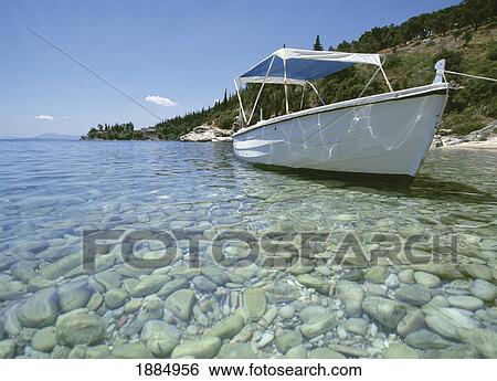 Boat Moored In Clear Water With Pebbles View Large Photo Image Stock Photograph - Boat Moored In Clear Water With Pebbles. Fotosearch