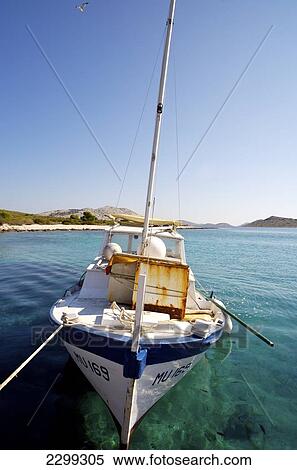 Boat moored in the clear turquoise water of Kornati archipelago; Croatia View Large Photo Image Stock Photography - Boat moored in the clear turquoise water of Kornati archipelago; Croatia. Fotosearch
