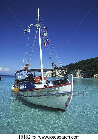 Boat Moored In Voutoumi Bay View Large Photo Image Stock Photography - Boat Moored In Voutoumi Bay. Fotosearch