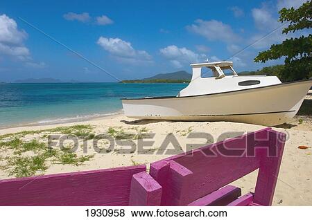 Boat On Land With A Bench On Paradise Beach, Carriacou Islands; Grenada, Caribbean View Large Photo Image Stock Photo - Boat On Land With A Bench On Paradise Beach, Carriacou Islands; Grenada, Caribbean. Fotosearch