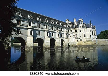 Stock Image - Boat On River Cher In Front Of Chateau De Chenonceau. Fotosearch