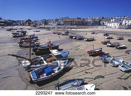 Boat on the shore in the harbour; St Ives, Cornwall, England View Large Photo Image Stock Photo - Boat on the shore in the harbour; St Ives, Cornwall, England. Fotosearch