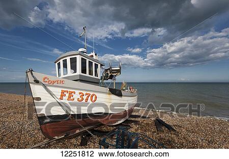 Stock Image - Boat on the shore; Walmer, Dover, Kent, England. Fotosearch