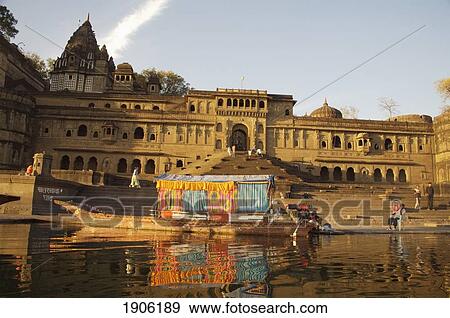 Boat Palace On Narmada River In Front Of Ahilya Fort, Maheshwar, Madhya Pradesh, India View Large Photo Image Stock Photo - Boat Palace On Narmada River In Front Of Ahilya Fort, Maheshwar, Madhya Pradesh, India. Fotosearch