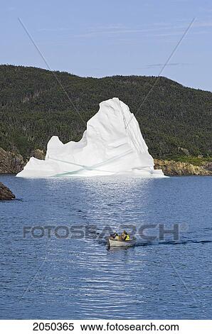 Boat Passing Iceberg In Trinity Bay Off The Bonavista Peninsula Of Eastern Newfoundland View Large Photo Image Stock Photography - Boat Passing Iceberg In Trinity Bay Off The Bonavista Peninsula Of Eastern Newfoundland. Fotosearch
