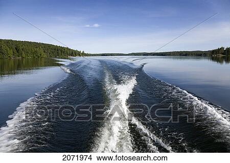 Boat Wake On Northern Lake, Ontario View Large Photo Image Picture - Boat Wake On Northern Lake, Ontario. Fotosearch