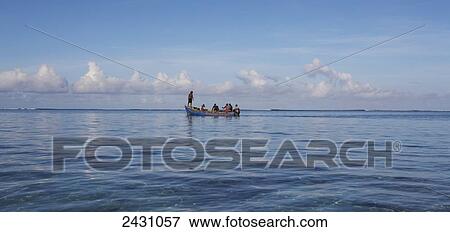 Stock Photo - Boat with passengers on the Indian Ocean; Mauritius. Fotosearch