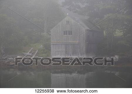 Stock Photo - Boathouse in fog; New Harbor, Maine, United States of America. Fotosearch