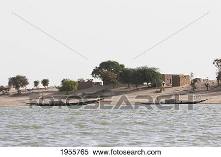 Stock Photography - Boats Along The Shores Of The Niger River Between Niafunke And Kabara, Mali. Fotosearch