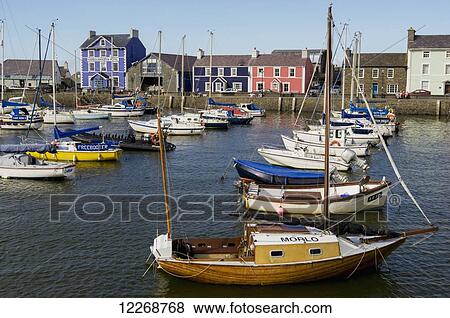 Boats and colourful houses in the Aberaeron port; Aberaeron, Ceredigion, Wales View Large Photo Image Stock Photo - Boats and colourful houses in the Aberaeron port; Aberaeron, Ceredigion, Wales. Fotosearch