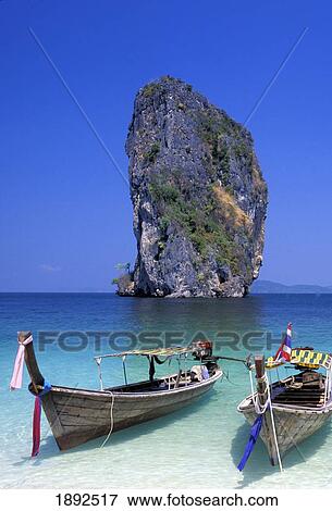 Stock Photo - Boats And Seastack. Fotosearch