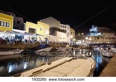 Stock Photography - Boats And Terraces At Ciutadella's Port At Night, Ciutadella, Menorca, Balearic Islands, Spain. Fotosearch