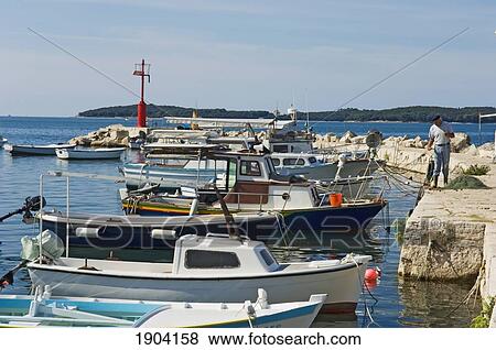 Boats At Fazana Village Harbor, Croatia View Large Photo Image Stock Photo - Boats At Fazana Village Harbor, Croatia. Fotosearch