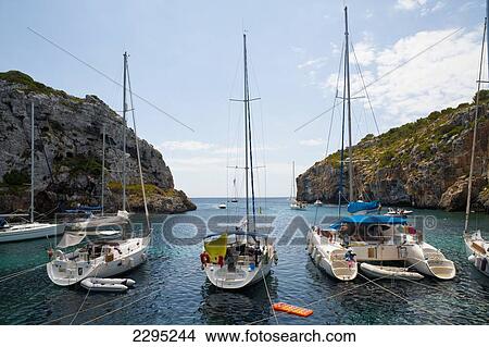 Picture - Boats In Cales Coves, Menorca, Balearic Islands, Spain. Fotosearch