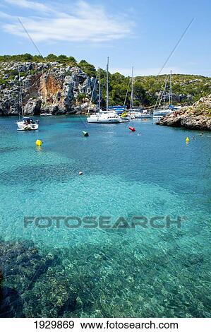 Stock Photo - Boats In Cales Coves, Menorca, Balearic Islands, Spain. Fotosearch