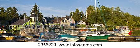 Boats In Early Morning Light At The Knowlton Marina On Brome Lake; Knowlton, Quebec, Canada View Large Photo Image Stock Photo - Boats In Early Morning Light At The Knowlton Marina On Brome Lake; Knowlton, Quebec, Canada. Fotosearch