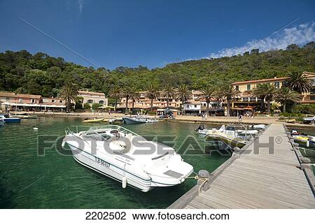 Stock Image - Boats in harbour of the village of Port-Cros on the island of Port-Cros, Port-Cros National Park; Provence, France. Fotosearch