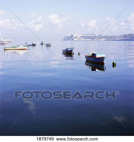 Stock Photo - Boats In Still Harbour. Fotosearch