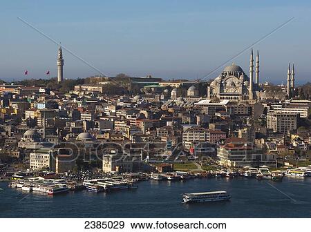 Boats in the Bosphorus with a view of buildings and mosques in the city; Istanbul, Turkey View Large Photo Image Stock Photo - Boats in the Bosphorus with a view of buildings and mosques in the city; Istanbul, Turkey. Fotosearch