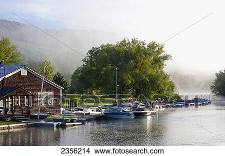 Boats In The Early Morning Mist; North Hatley, Quebec, Canada View Large Photo Image Picture - Boats In The Early Morning Mist; North Hatley, Quebec, Canada. Fotosearch