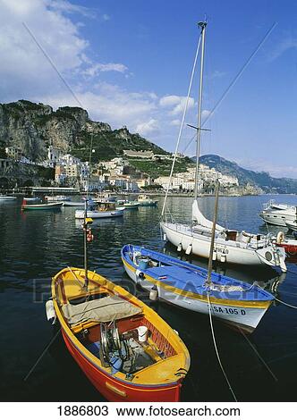 Stock Image - Boats In The Harbor Along The Amalfi Coast. Fotosearch