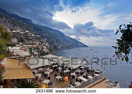 Boats in the harbour and buildings laong the coastline of Positano-Montemare, Amalfi Coast; Positano, Italy View Large Photo Image Stock Photograph - Boats in the harbour and buildings laong the coastline of Positano-Montemare, Amalfi Coast; Positano, Italy. Fotosearch