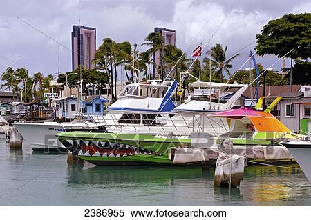 Boats in the harbour at the waterfront with skyscraper condominiums in the distance; Honolulu, Oahu, Hawaii, United States of America View Large Photo Image Stock Photography - Boats in the harbour at the waterfront with skyscraper condominiums in the distance; Honolulu, Oahu, Hawaii, United States of America. Fotosearch