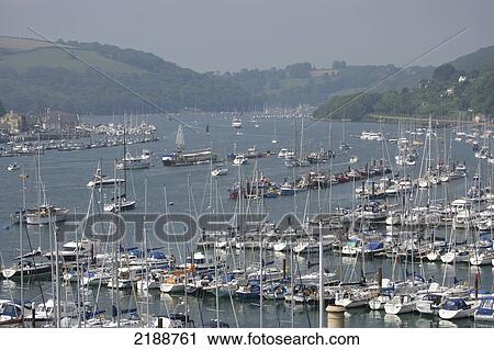 Boats in the harbour of River Dart; South Hams, Devon, England View Large Photo Image Stock Image - Boats in the harbour of River Dart; South Hams, Devon, England. Fotosearch