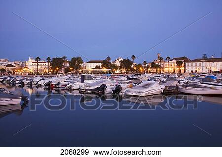 Boats In The Harbour Reflected In The Water At Dusk; Faro Algarve Portugal View Large Photo Image Stock Photo - Boats In The Harbour Reflected In The Water At Dusk; Faro Algarve Portugal. Fotosearch