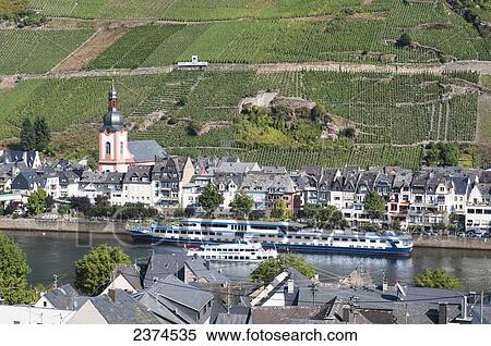 Stock Photography - Boats in the Moselle River with vineyards on the slopes; Mosel, Germany. Fotosearch
