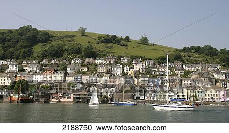 Boats in the River Dart with houses on the hillside; Dartmouth, Devon, England View Large Photo Image Stock Image - Boats in the River Dart with houses on the hillside; Dartmouth, Devon, England. Fotosearch