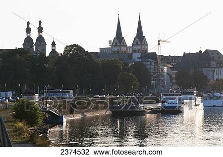 Stock Image - Boats in the river Rhine along the waterfront; Koblenz, Germany. Fotosearch