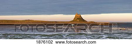 Boats In The Water And A Castle On The Tidal Island Also Known As Holy Island; Lindisfarne, Northumberland, England View Large Photo Image Stock Image - Boats In The Water And A Castle On The Tidal Island Also Known As Holy Island; Lindisfarne, Northumberland, England. Fotosearch