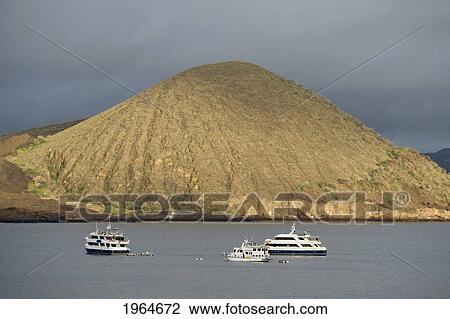 Stock Image - Boats In The Water Off The Coast Of Bartolome Island; Galapagos Equador. Fotosearch