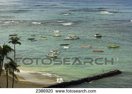 Boats in the water off Waikiki Beach; Honolulu, Oahu, Hawaii, United States of America View Large Photo Image Stock Image - Boats in the water off Waikiki Beach; Honolulu, Oahu, Hawaii, United States of America. Fotosearch
