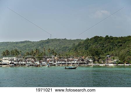 Stock Image - Boats In Tonsai Bay; Phi Phi Islands Thailand. Fotosearch