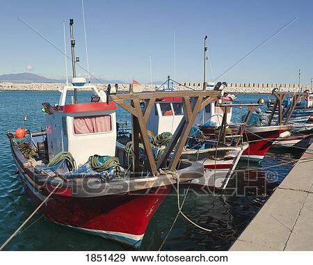 Stock Photo - Boats Lined Up At A Dock. Fotosearch