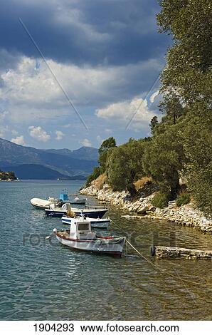 Stock Image - Boats Moored Along Coast, Vathi, Ionian Islands, Greece. Fotosearch