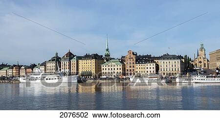 Stock Image - Boats Moored Along The Water's Edge; Stockholm Sweden. Fotosearch