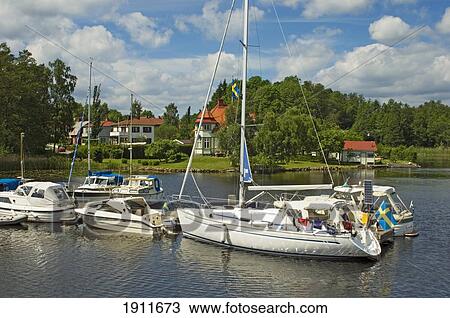 Boats Moored At Gota Canal, Sweden View Large Photo Image Stock Image - Boats Moored At Gota Canal, Sweden. Fotosearch